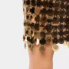 Fusta cu discuri aurii strălucitoare Fusta cu discuri aurii strălucitoare